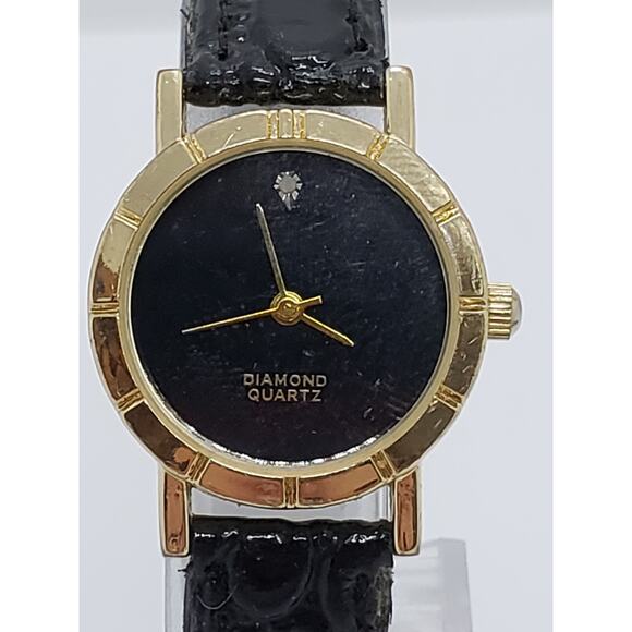 Men's Diamond quartz dress watch. Black and gold face. Classic design